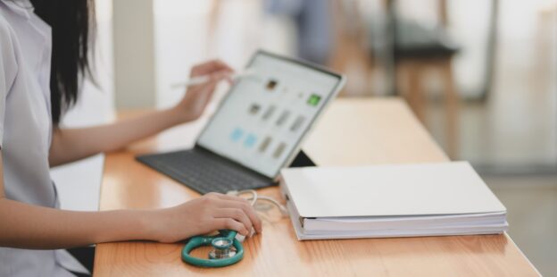 Doctor at a desk with computer